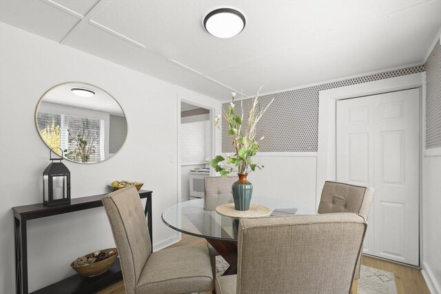 63 Adams St, Bourne, MA 02532 - dining space with light wood finished floors