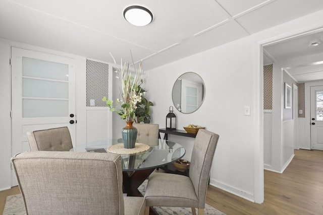 63 Adams St, Bourne, MA 02532 - dining room featuring baseboards and wood finished floors
