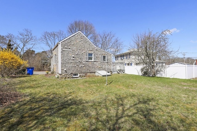 63 Adams St, Bourne, MA 02532 - rear view of house with fence and a yard