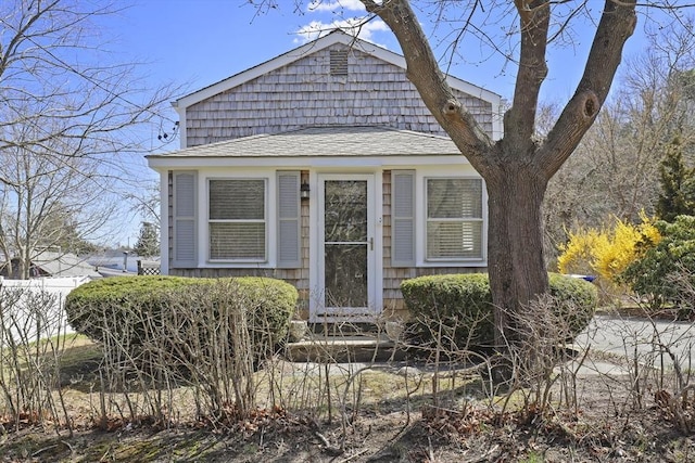 63 Adams St, Bourne, MA 02532 - view of front of property featuring roof with shingles and fence