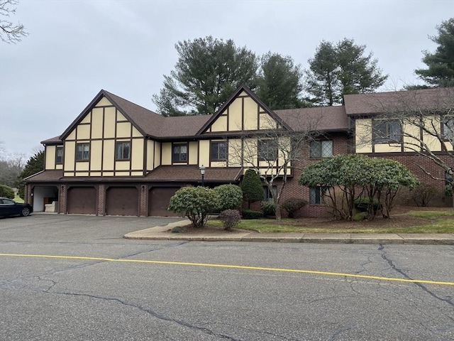 tudor home featuring a garage