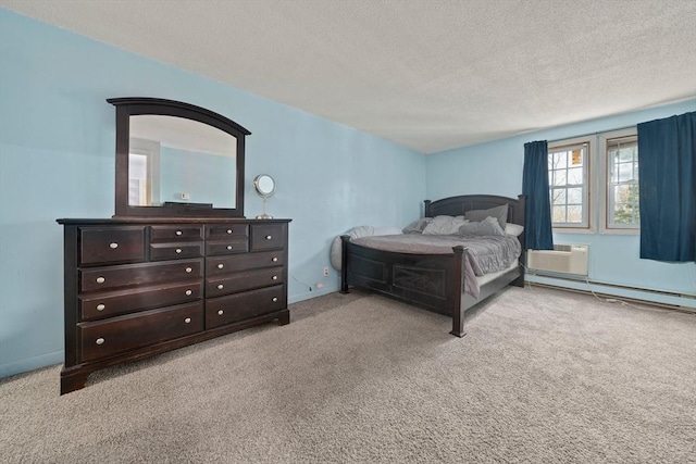 carpeted bedroom featuring a baseboard heating unit, baseboards, a textured ceiling, and a wall unit AC