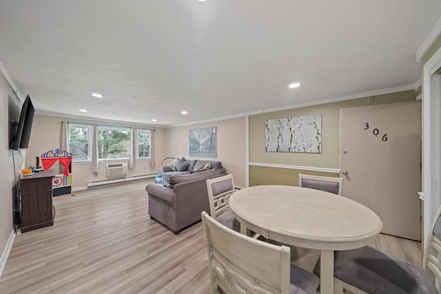 dining space with recessed lighting, baseboard heating, light wood-style flooring, and crown molding