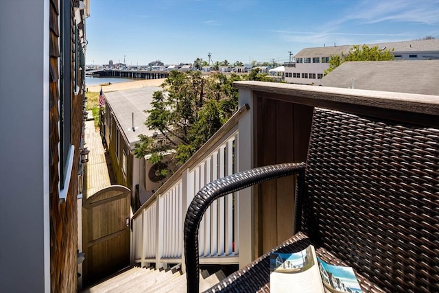 balcony featuring a water view