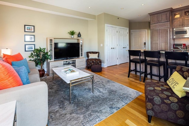 living room with light hardwood / wood-style floors