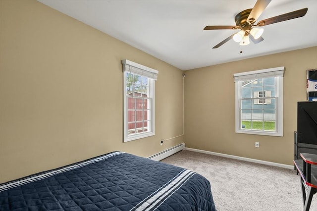 bedroom with baseboards, carpet flooring, baseboard heating, and ceiling fan