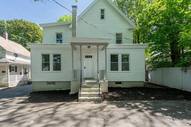 view of front of house featuring fence