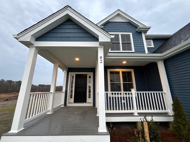 doorway to property featuring a porch