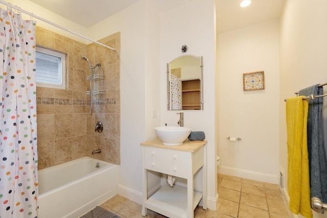 full bathroom with tile patterned flooring, shower / bath combination with curtain, vanity, and toilet