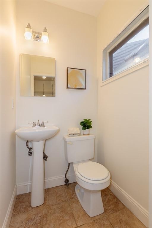 bathroom featuring tile patterned floors and toilet