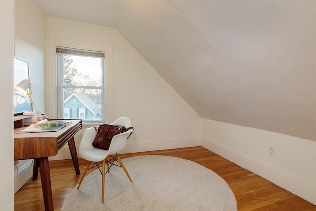 sitting room with lofted ceiling and light hardwood / wood-style flooring