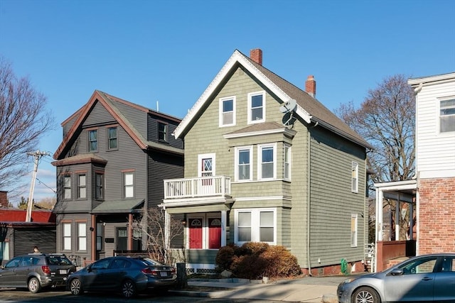 view of front of property featuring a balcony