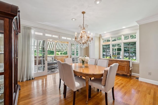 20 Hillery Rd, Leominster, MA 01453 - dining space featuring ornamental molding, healthy amount of natural light, a chandelier, light wood-style floors, and baseboards
