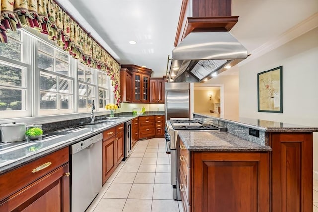 20 Hillery Rd, Leominster, MA 01453 - kitchen with stainless steel appliances, light tile patterned floors, dark stone counters, glass insert cabinets, and brown cabinetry