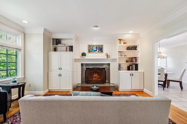 20 Hillery Rd, Leominster, MA 01453 - living area with a premium fireplace, ornamental molding, baseboards, light wood finished floors, and recessed lighting