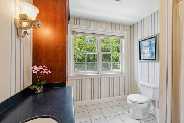 20 Hillery Rd, Leominster, MA 01453 - bathroom with wallpapered walls, tile patterned floors, baseboards, and toilet