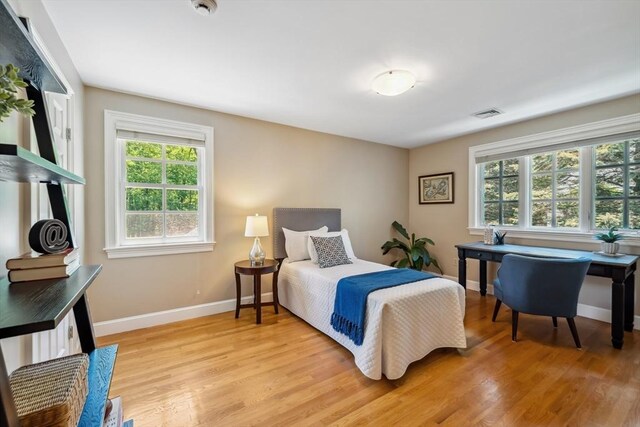 20 Hillery Rd, Leominster, MA 01453 - bedroom with multiple windows, light wood-type flooring, and baseboards