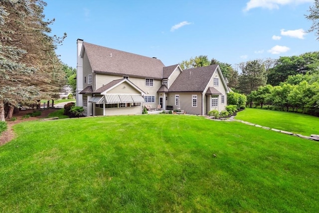 20 Hillery Rd, Leominster, MA 01453 - back of house with a lawn, a chimney, and roof with shingles