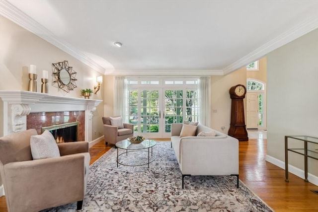20 Hillery Rd, Leominster, MA 01453 - living area featuring ornamental molding, a premium fireplace, wood finished floors, baseboards, and french doors
