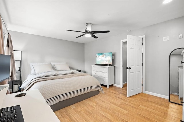 bedroom with baseboards, light wood-style floors, and ceiling fan