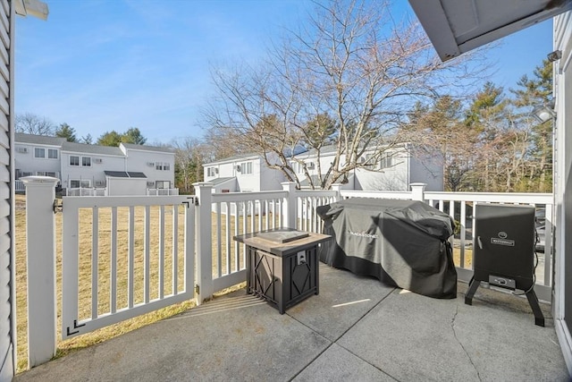 view of patio featuring a residential view and a grill