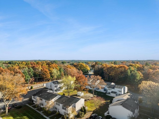 drone / aerial view featuring a wooded view