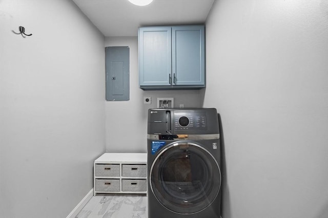 laundry area featuring marble finish floor, electric panel, cabinet space, baseboards, and washer / dryer