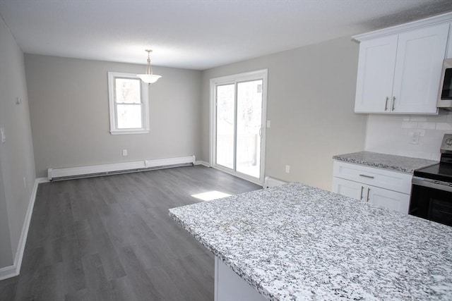 kitchen featuring wood finished floors, white cabinets, baseboard heating, stainless steel electric range, and decorative backsplash