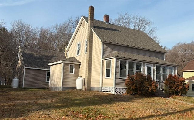 view of property exterior featuring a lawn