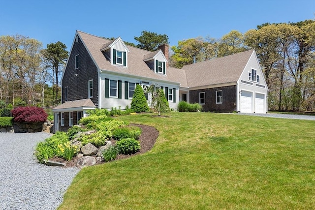 cape cod-style house with a front yard and a garage