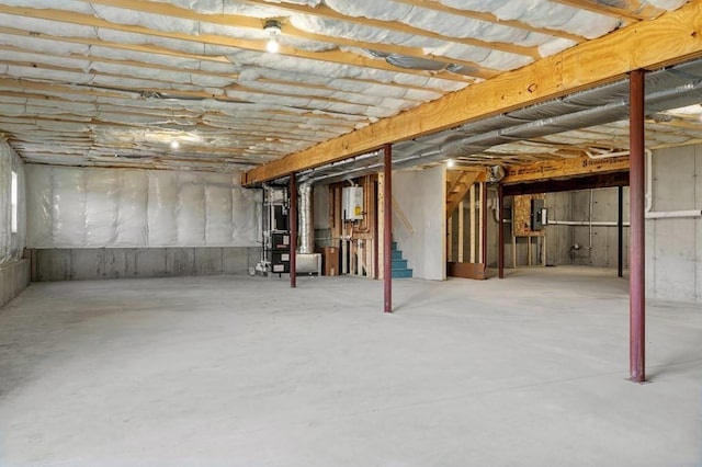 33 Crestwood Cir Unit 45, Northbridge, MA 01588 - unfinished below grade area with stairway, tankless water heater, and electric panel