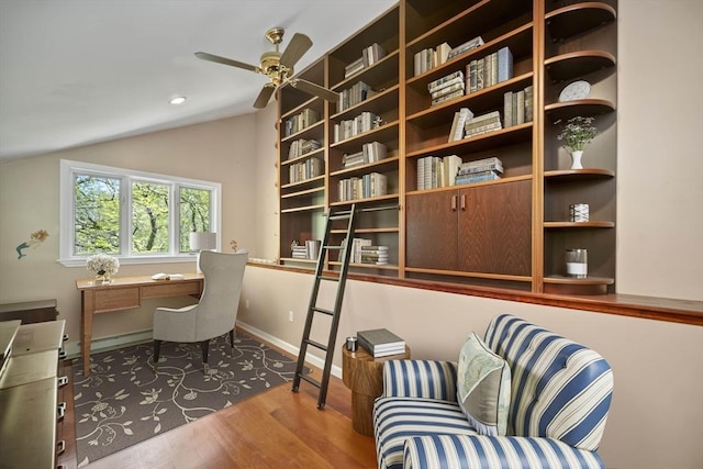 office area with hardwood / wood-style flooring, ceiling fan, and lofted ceiling