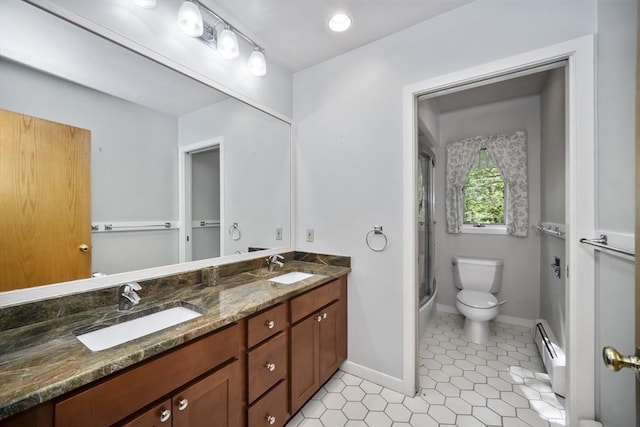 bathroom featuring tile patterned floors, vanity, a baseboard heating unit, toilet, and a shower with shower door