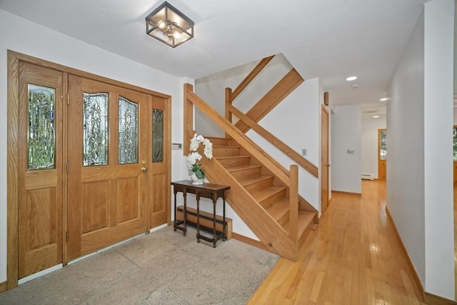 foyer entrance featuring hardwood / wood-style floors