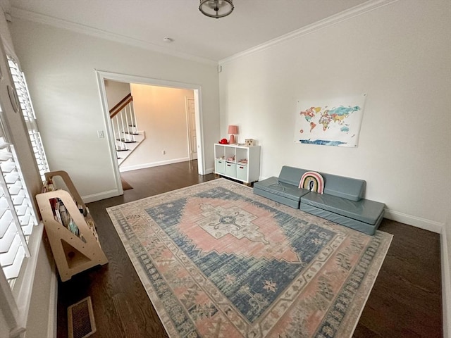 living area featuring ornamental molding, stairs, visible vents, and baseboards