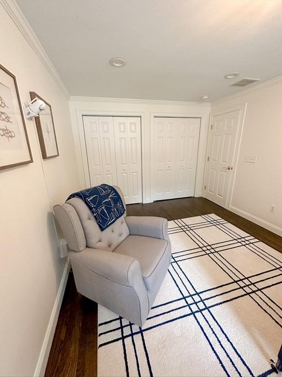 sitting room featuring baseboards, recessed lighting, crown molding, and dark wood-style floors