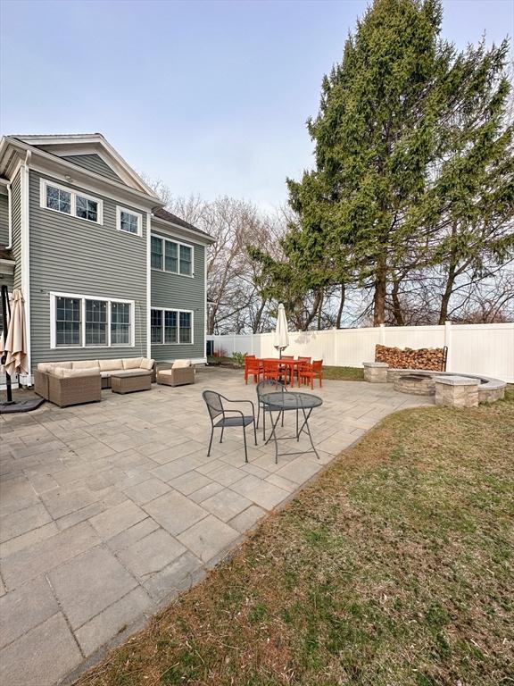 view of patio / terrace with an outdoor living space and fence