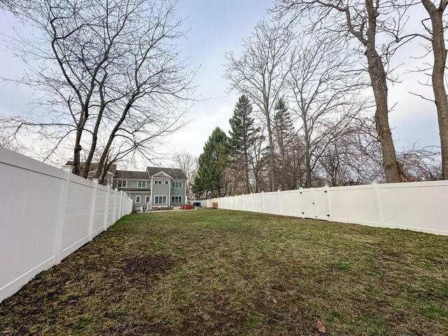 view of yard with a fenced backyard