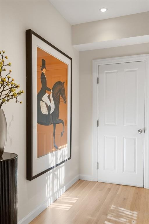 corridor with recessed lighting, light wood-style flooring, and baseboards