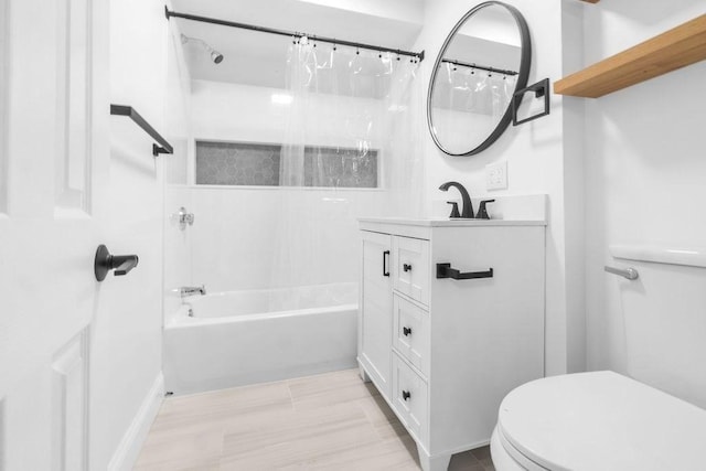 full bathroom featuring shower / tub combo with curtain, vanity, and toilet