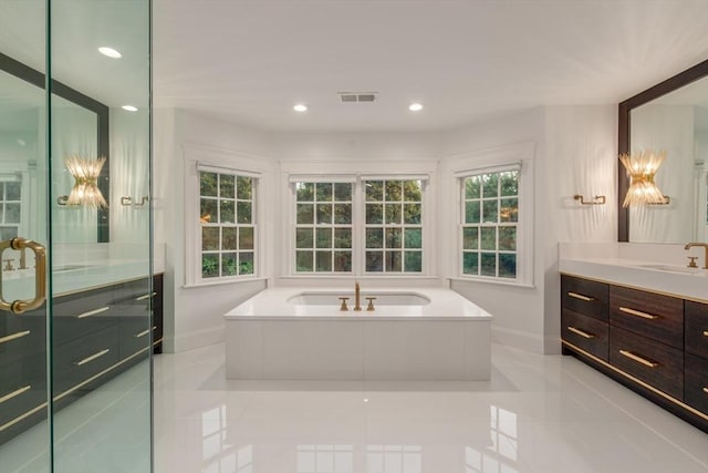 bathroom featuring visible vents, vanity, a shower stall, a bath, and recessed lighting