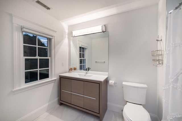 bathroom featuring baseboards, visible vents, toilet, marble finish floor, and vanity