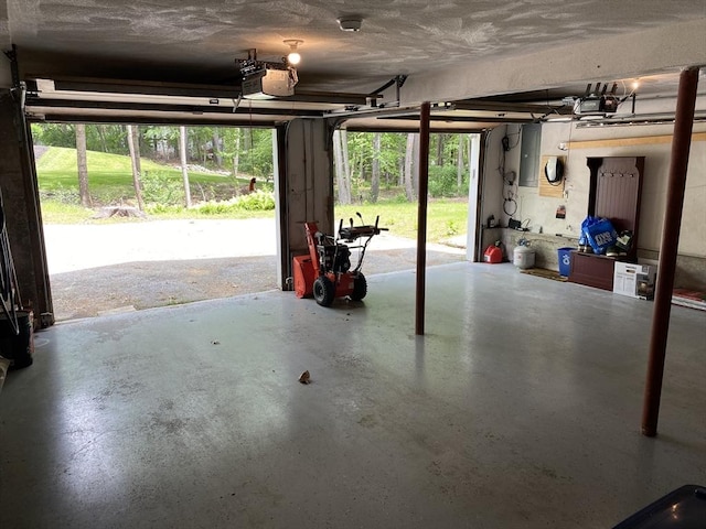 8 Tall Tree Way, Georgetown, MA 01833 - garage featuring a garage door opener