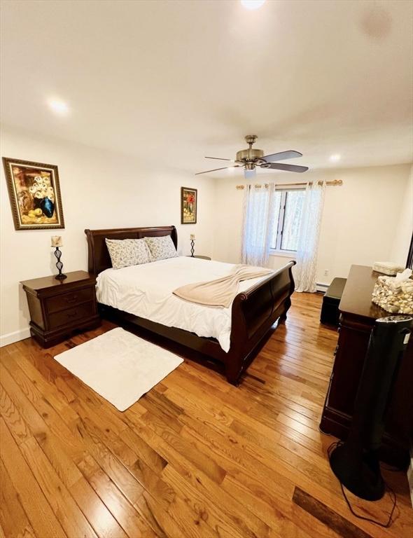 8 Tall Tree Way, Georgetown, MA 01833 - bedroom featuring light wood finished floors, ceiling fan, and baseboard heating