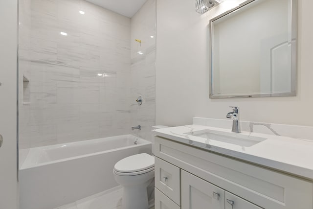 full bathroom with vanity, toilet, and tiled shower / bath