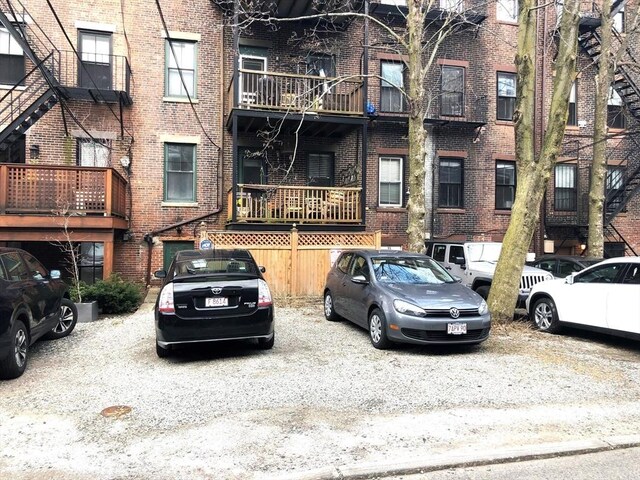 view of property featuring uncovered parking