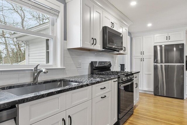 30 Millham St, Marlborough, MA 01752 - kitchen featuring stainless steel appliances, a sink, healthy amount of natural light, white cabinets, and recessed lighting