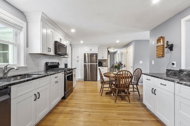 30 Millham St, Marlborough, MA 01752 - kitchen featuring stainless steel appliances, a sink, recessed lighting, light wood-type flooring, and white cabinetry