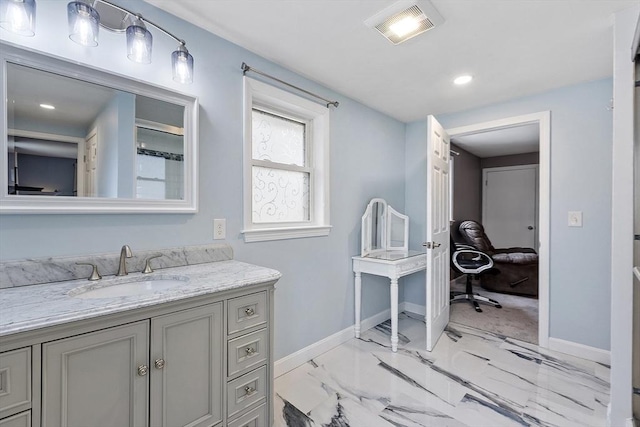 30 Millham St, Marlborough, MA 01752 - bathroom with baseboards, vanity, marble finish flooring, and recessed lighting