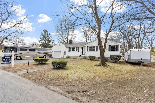 30 Millham St, Marlborough, MA 01752 - view of front of property featuring a chimney, a garage, asphalt driveway, and a front yard